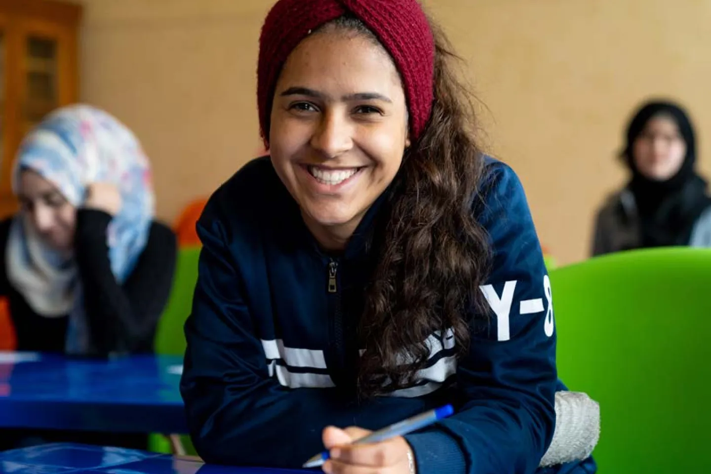 Girl smiles in a classroom