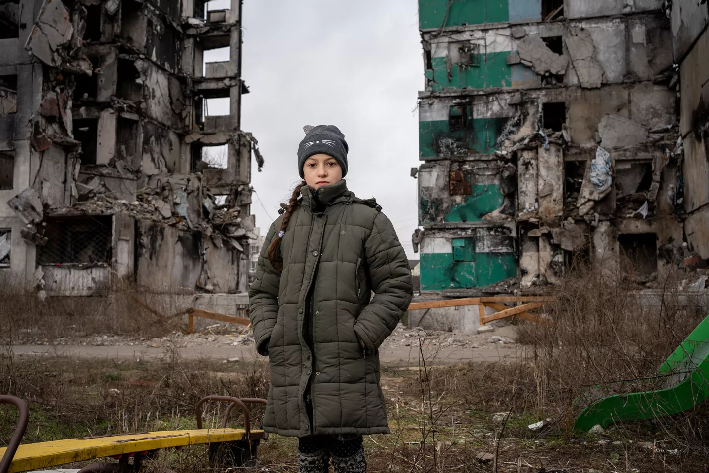 On January 30, 2023, 10-year-old Veronica visits the ruins of a high-rise building in the centre of Borodianka, Ukraine to feed three street cats.