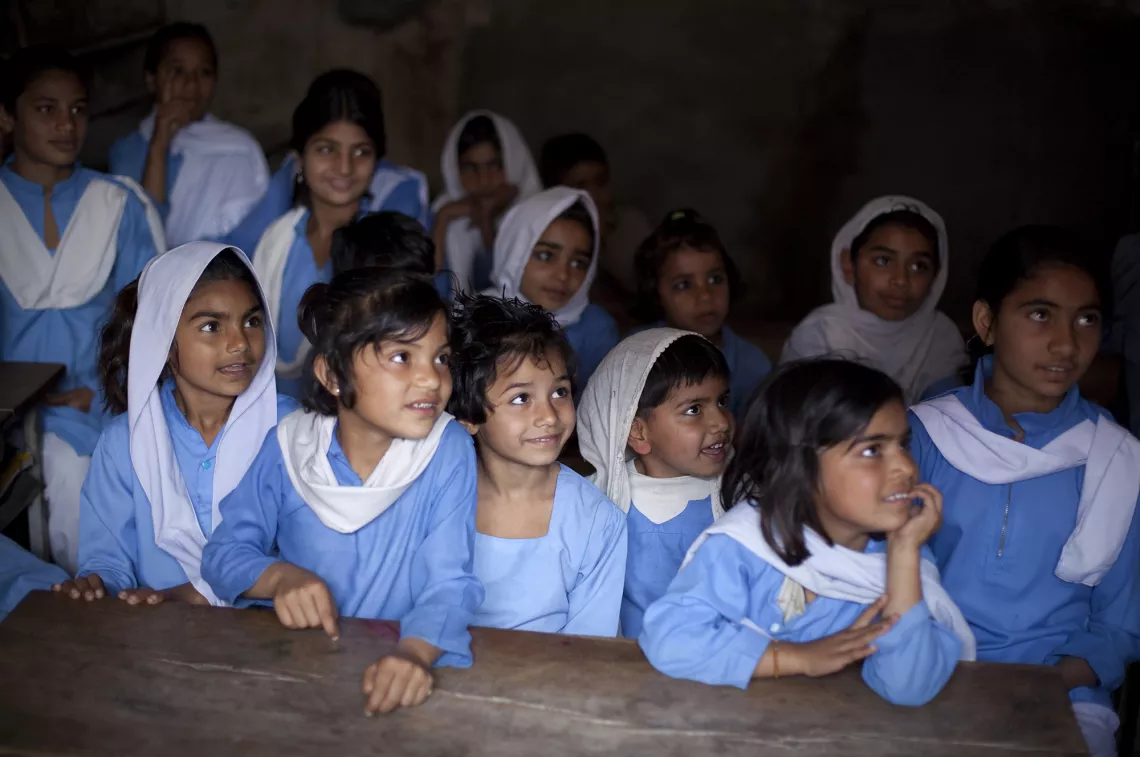 Students listen to their teacher at the Bareganwala Girls Government Primary School, Pakistan.